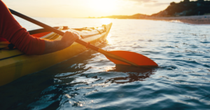 kayak on the ater by the isle of wight needles in the evening sunshine